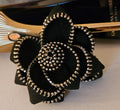 Broche flor cremallera negra